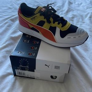 men’s size 9.5 puma RS-100 x Roland